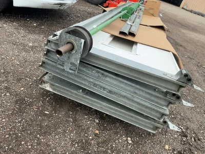 Used 8’ Tall x 10’ Wide Insulated Roll Up Door, comes with tracks, spring, and hardware, four panels...