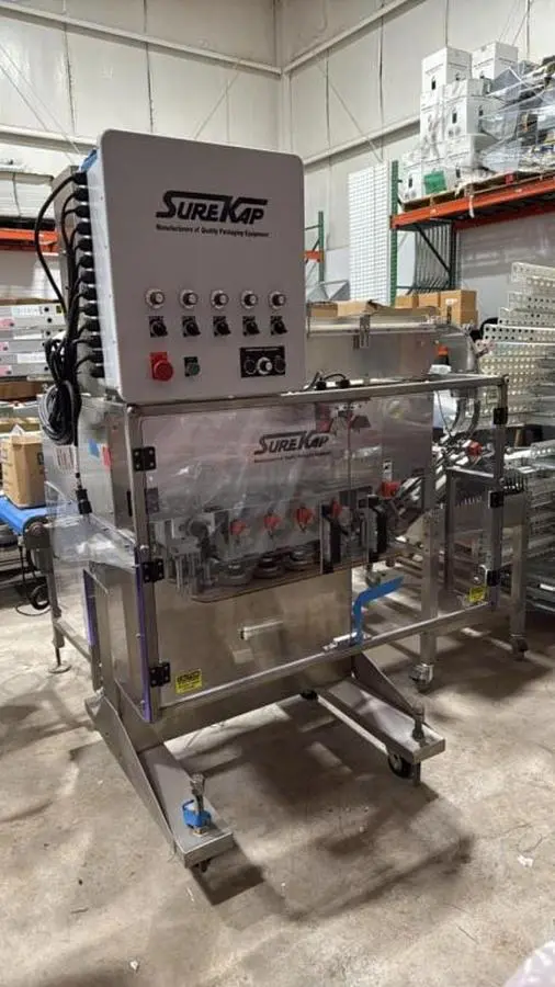 USED SUREKAP MODEL SK8000-BF6-70 AUTOMATIC SPINDLE CAPPER SUREKAP MODEL SK8000-BF6-70 AUTOMATIC SPINDLE CAPPER
