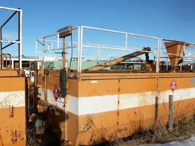 USED 20 M3 (120 BBL) SKID MOUNTED 2 COMPARTMENT MUD TANK