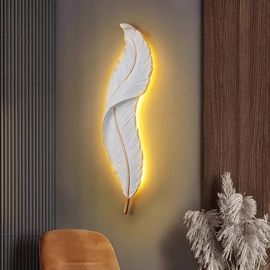 White and gold feather wall sconce