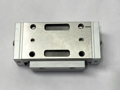 USED SMC PNEUMATIC SLIDE TABLE MISSING SHOCK ABSORBER