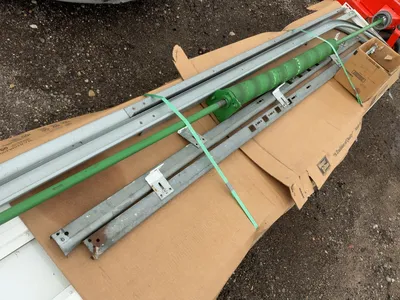 Used 8’ Tall x 10’ Wide Insulated Roll Up Door, comes with tracks, spring, and hardware, four panels...