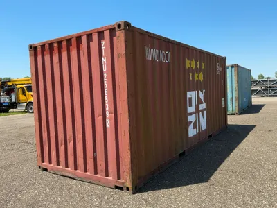 20’ Shipping / Storage Container 8’ wide x 8’ 6” tall, swing doors on one end, wood deck, rings for ...