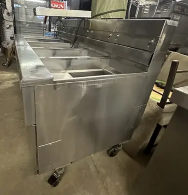 174-0002 Pitco SSH55 and SSHBN55 Battery of 4 Fryers with Middle Dump Station an