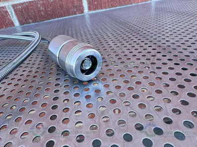 USED 66" STAINLESS STEEL FLEXIBLE BRAIDED HOSE W/ QUICK CONNECTIONS