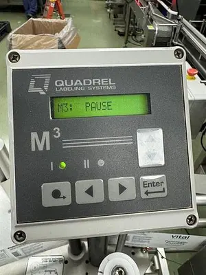 Quadrel model Moduline pressure sensitive wraparound labeler