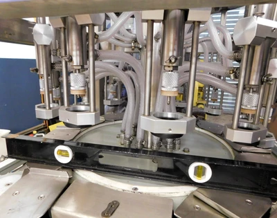 USED JG VACUUM FILLER 12 STATION