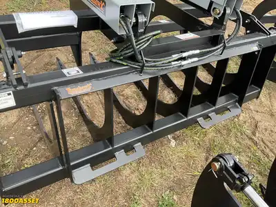 New Tomahawk 66” brush grapple attachment, two hydraulic grapple arms, skid steer quick attach