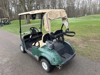 (1) 2015 E-Z-Go golf cart with a Kawasaki gas engine, includes ball washer and Club canopy, ball cov...