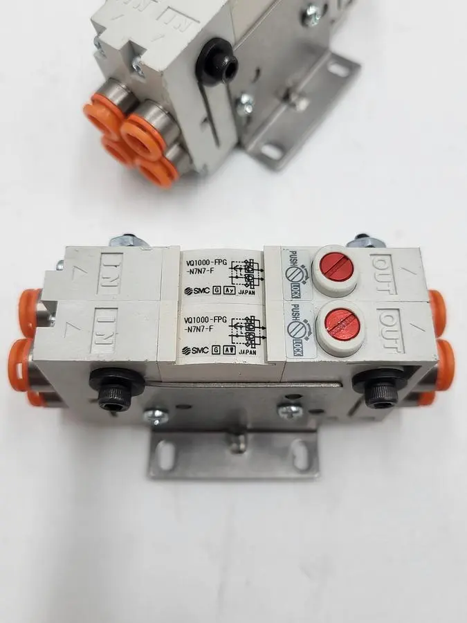 USED SMC SMC CORPORATION VQ1000-FPG-N7N7-F PERFECT CHECK TWO BLOCKS MERGED & MOUNTED ON BRACKET