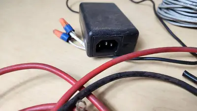 Mixed Electrical Components and Accessories including Various Cables, Connectors, and Switches