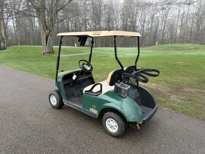 (1) 2015 E-Z-Go golf cart with a Kawasaki gas engine, includes Club Clear club and ball washer, does...
