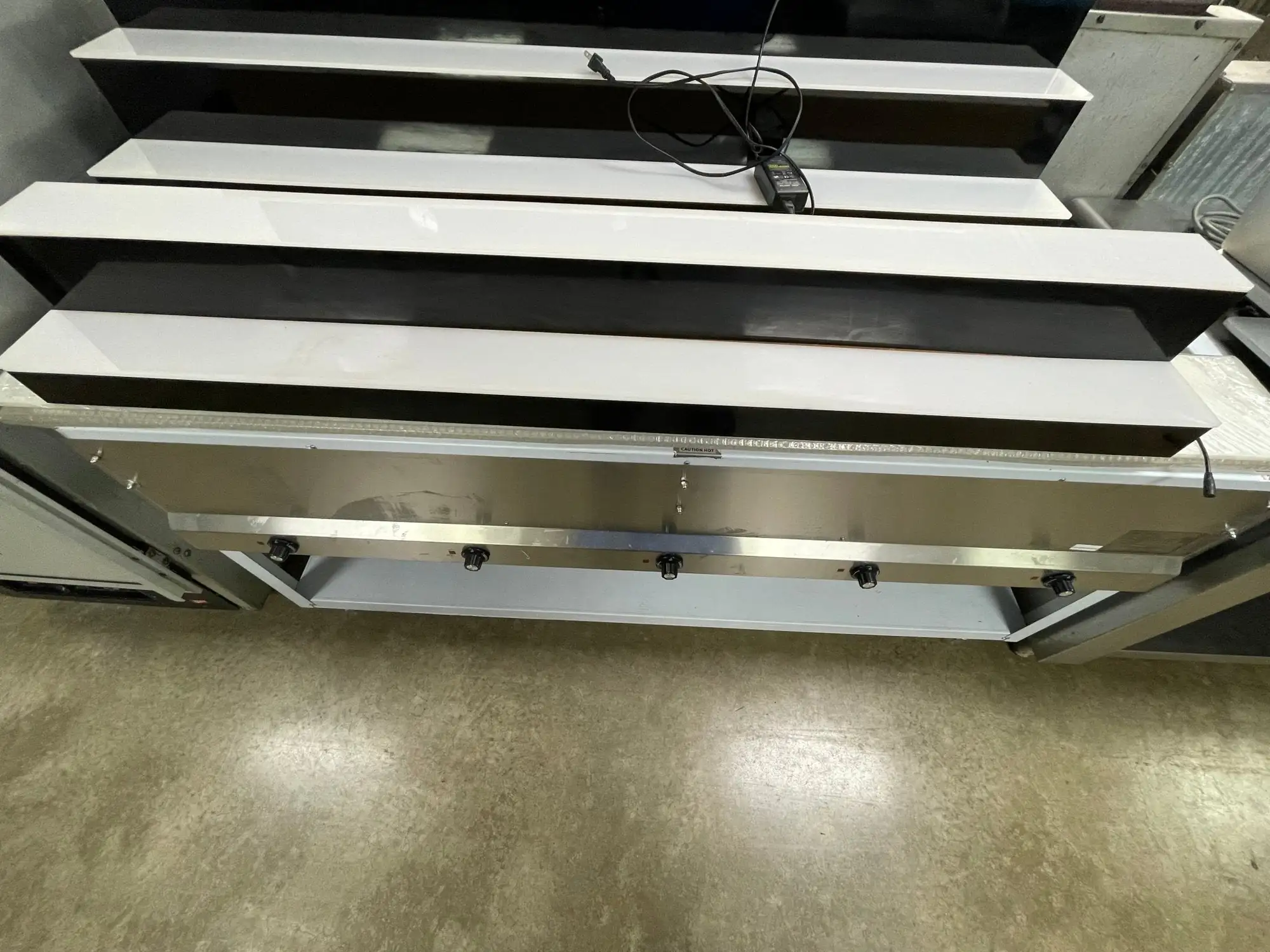 Used Baseline Used LED Baseline 60" 2 Tier LED Lighted Liquor Display Shelf 120V Black Bar Equipment Illinois US | Falcon Restaurant Supply #1376427