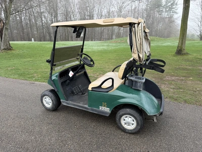 (1) 2015 E-Z-Go golf cart with a Kawasaki gas engine, includes Club canopy, ball washer, fold-down w...