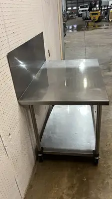 Used Falcon Restaurant Supply Used 48"x 30" Stainless Steel Table with Casters and a 16" Backsplash - FG Food Prep Tables Illinois US | Falcon Restaurant Supply #1374938