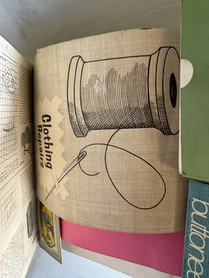 (1) Singer Tiny over edging machine, assorted patterns, and sewing items.