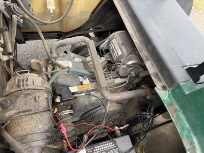 (1) 2015 E-Z-Go golf cart with a Kawasaki gas engine, does not include Club canopy, includes ball wa...