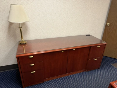 Contents of office furniture, includes (1) wood desk with glass top, 71" x 36", (1) wood credenza wi...