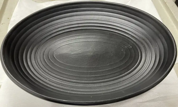 Used Tuxton Used Tuxton TuxTrendz Zion Matte Black 35 oz. Embossed Oval China Bowl - WO1 Smallwares Illinois US | Falcon Restaurant Supply #1375421