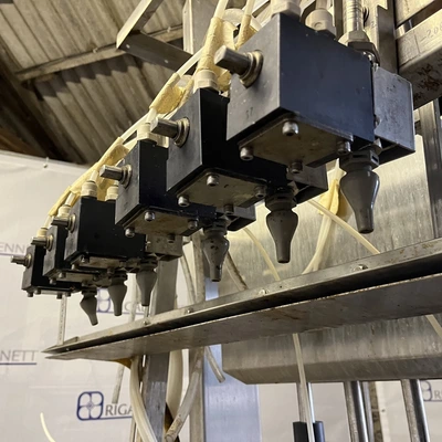6 Head ELF Filler with feed tanks & container link belt conveyor