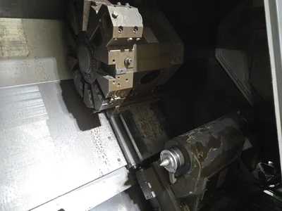 Hyundai SKT-400C F21ITB CNC Lathe w/ Tailstock and Indexer, 10 Slot Turret, LNS Conveyor, 3-Jaw