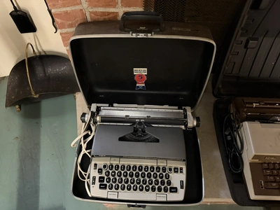 (1) SCM Smith Corona Electra 120 typewriter with case.