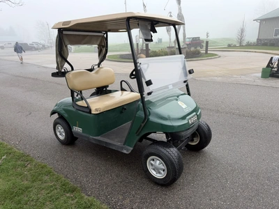 (1) 2015 E-Z-Go golf cart with a Kawasaki gas engine, includes canopy, fold-down windshield, and bal...