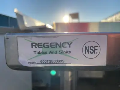 Used Regency Used Regency 30"X60" Stainless Steel Table with Shelf and 4" Backsplash JD - SS322 Food Prep Tables Illinois US | Falcon Restaurant Supply #1375170