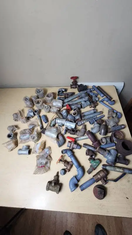 Lot of Plumbing Hardware and Fittings including Galvanized Nipples, Elbows, Valves, and Connectors