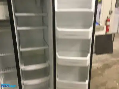 USED GE STAINLESS STEEL AND BLACK SIDE X SIDE REFRIGERATOR HEAVY DUTY ENERGY STAR