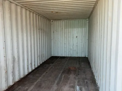 20’ Shipping / Storage Container 8’ wide x 8’ 6” tall, swing doors on one end, wood deck, rings for ...