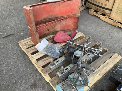 Skid lot of 4 piece swivel casters with bumpers, pulley with cord and remote, a snow scraper, a trac...