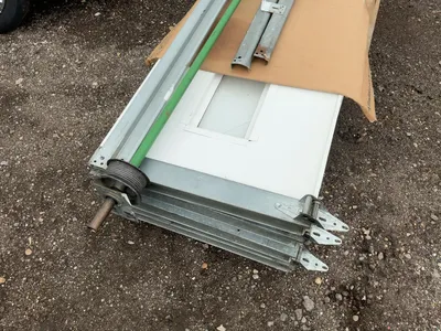 Used 8’ Tall x 10’ Wide Insulated Roll Up Door, comes with tracks, spring, and hardware, four panels...