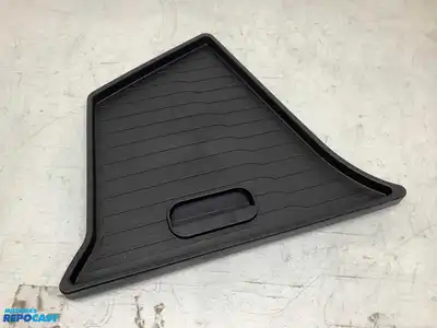 Lot of various car parts including Tesla storage bins, a sunroof deflector, mud flaps, a Colorado...