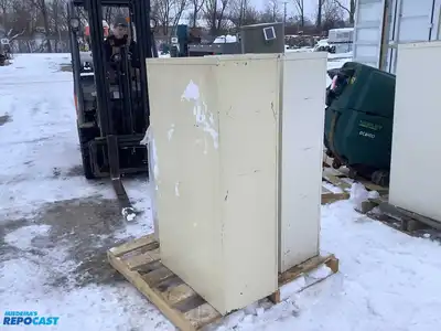 Lot of (2) metal filing cabinets with 4 drawers approx. 15”x29”x52” (one has handles)