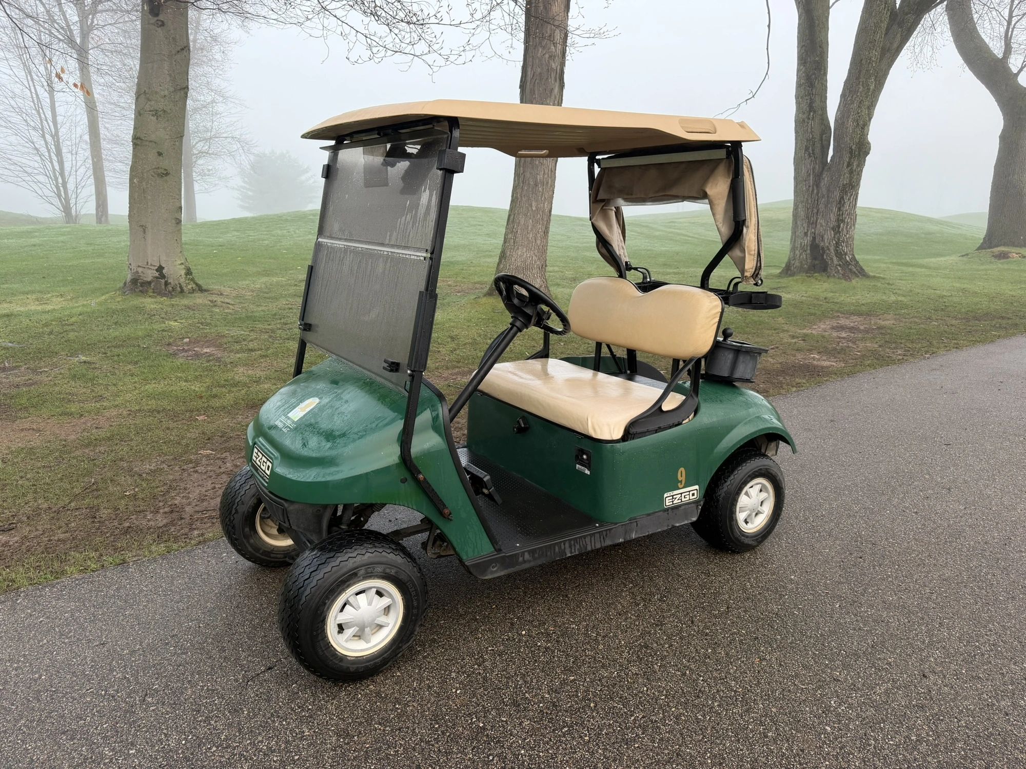 (1) 2015 E-Z-Go golf cart with a Kawasaki gas engine, includes canopy, ball cover, club cover, fold-...