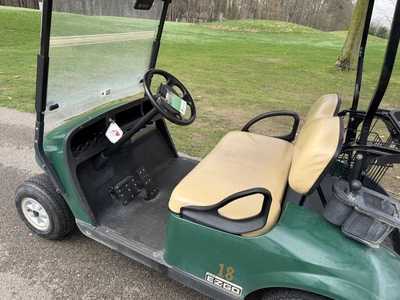 (1) 2015 E-Z-Go golf cart with a Kawasaki gas engine, does not include Club canopy, includes ball wa...