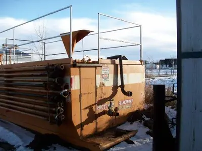 USED 20 M3 (120 BBL) SKID MOUNTED 2 COMPARTMENT MUD TANK