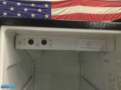 USED FRIGIDAIRE STAINLESS STEEL AND BLACK SIDE BY  SIDE REFRIDGERATOR HIGH EFFICANCY ENERGY STAR