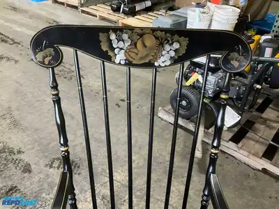 Lot of (2) wooden rocking chairs- brown press back oak rocking chair & black Boston rocker...