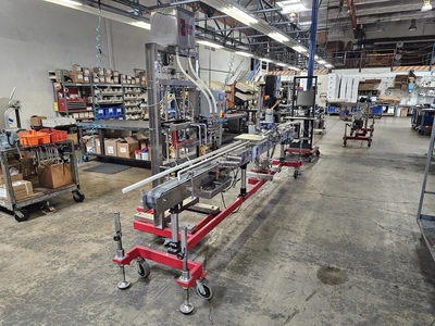 USED 1900 ACCUTEK/CHADAM 2 HEAD GRAVITY FILLER