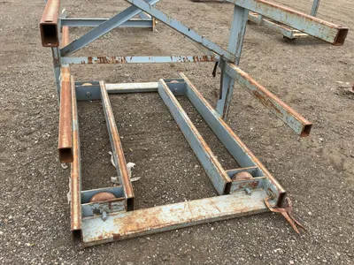 Metal Two Sided Cantilever Rack, on wheels so it can roll sideways (wheels are missing outer coating...