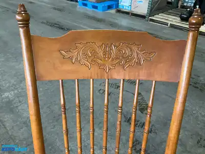 Lot of (2) wooden rocking chairs- brown press back oak rocking chair & black Boston rocker...