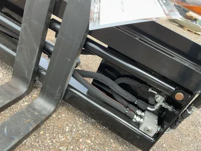 Used WOLVERINE PFA-11-3300G SKID STEER PALLET FORK HYDRAULIC ADJUSTABLE Pallet Forks Michigan US | Miedema Asset Management Group #1468700