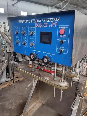 Inline Filling Systems capper with Waterfall feeder