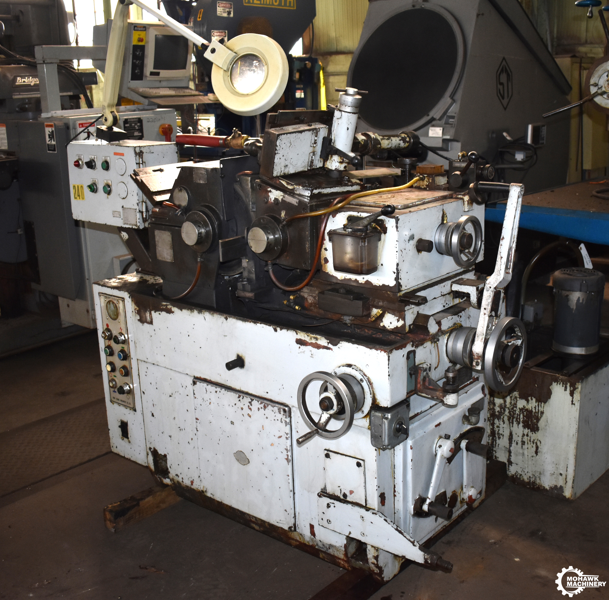 U12 UNISON "HIGH-PRODUCTION" CENTERLESS GRINDER w/THRUFEED WORKREST - COOLANT SYSTEM