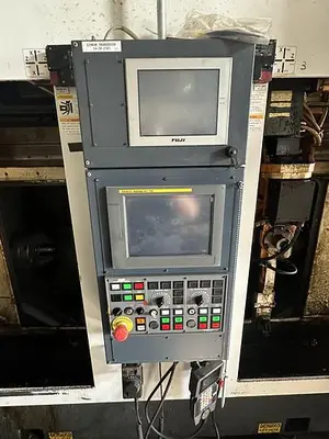 Used FUJI ANW 35 TWIN TURRET CNC LATHE, TAIL STOCK WITH ROBOT LOAD/UNLOAD AND STOCKER TABLES CNC Lathes | Harbor Machinery Inc. #1283395