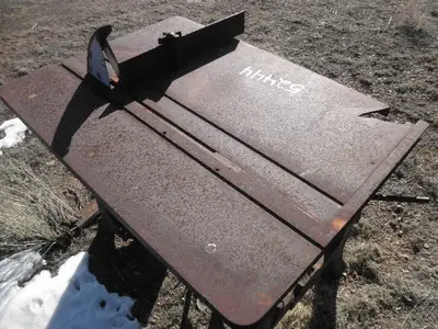 USED METAL TABLE SAW -