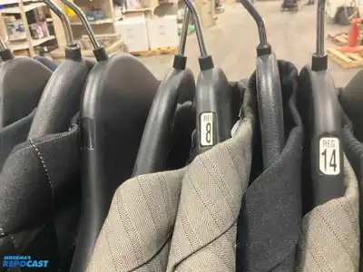 Lot of (21) assorted size youth suit coats and rack