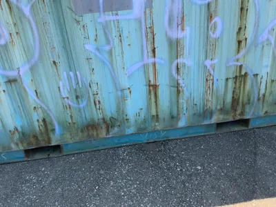 20’ Shipping / Storage Container 8’ wide x 8’ 6” tall, swing doors on one end, wood deck, rings for ...